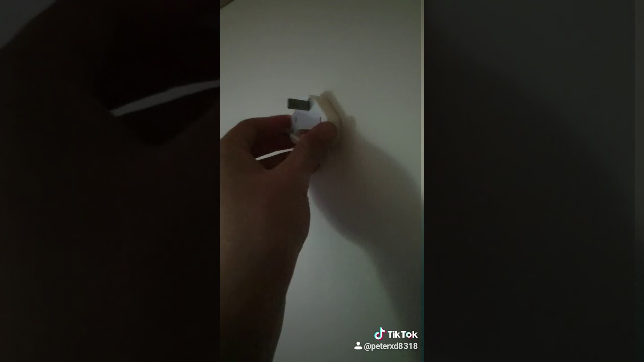 how to stick a iphone charger to a wall