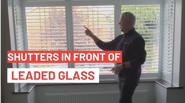 What do shutters look like in front of leaded glass?