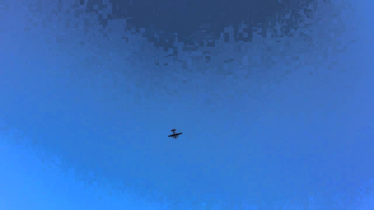 Prop Plane Flies Overhead in Blue Skies - YouTube