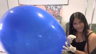 Blue Balloon Blowing Up A Big Balloon Wearing Latex Gloves