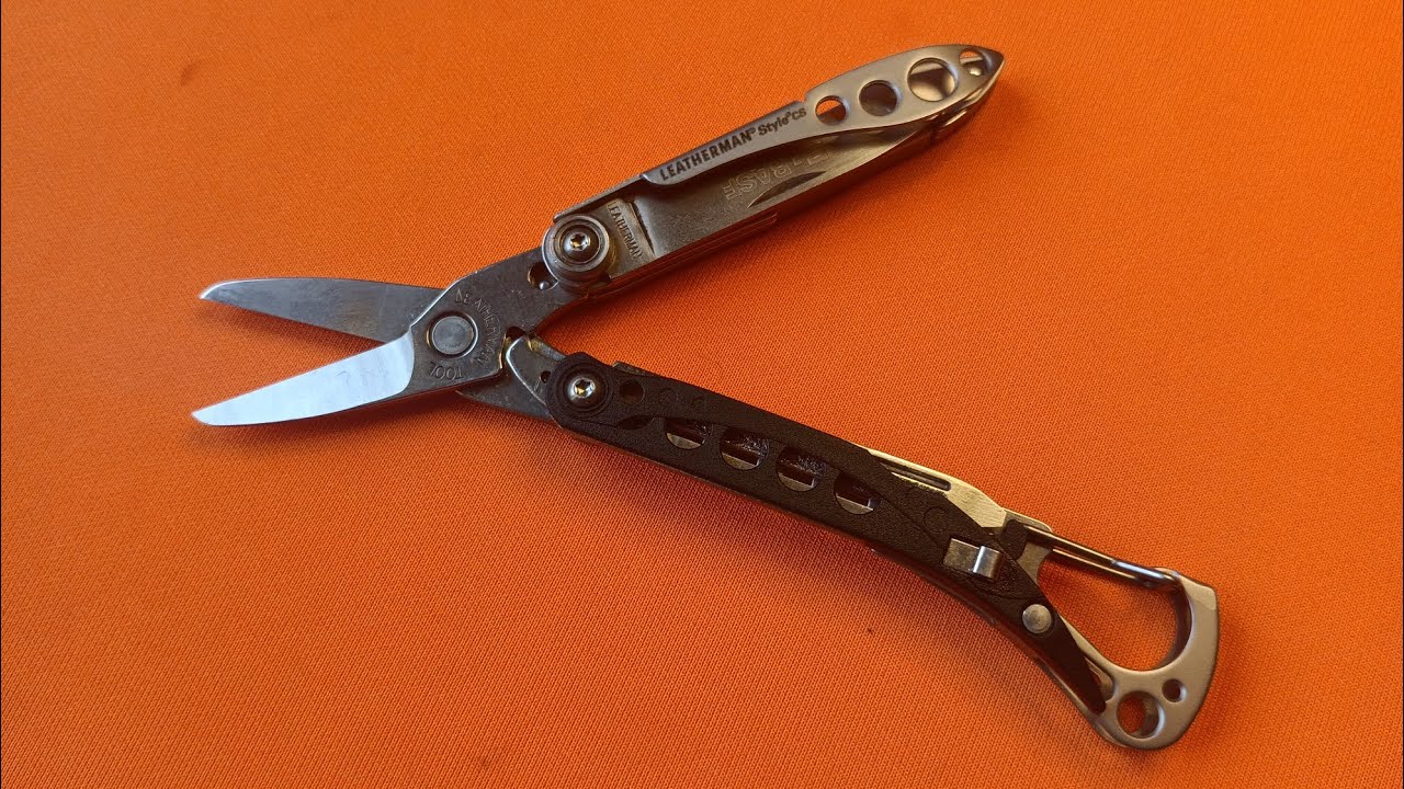 Leatherman Style CS. EDC mini tool with graffiti on a knife.