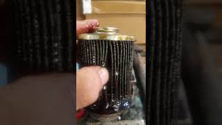 Cutting an oil filter open for inspection