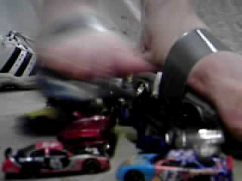 Camaro and race car through junkyard