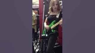 Nita Strauss and Courtney Cox Jamming out at the NAMM show.