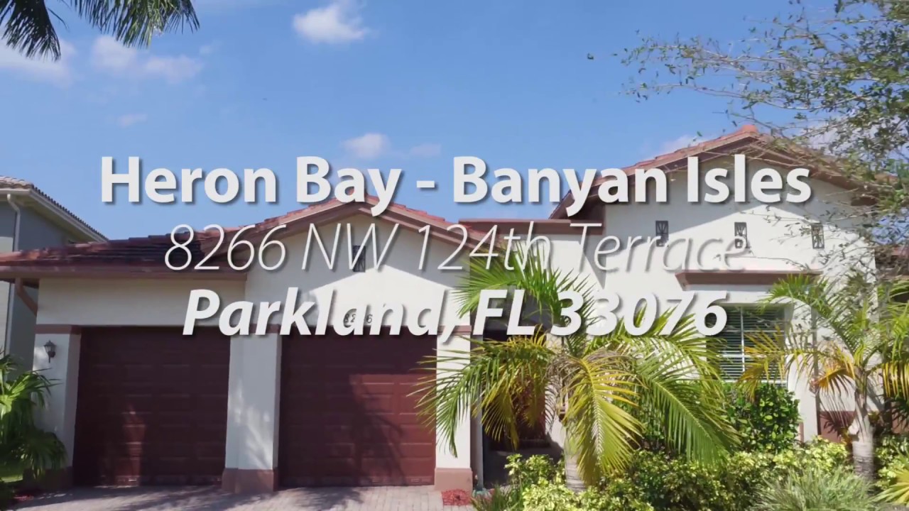 8266 NW 124th Heron Bay Banyan Isles Lakefront Dream Home in Parkland
