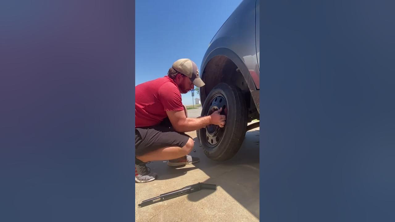 Changing a tire on a Ford Explorer - YouTube