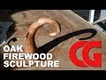 Finishing the oak firewood sculpture