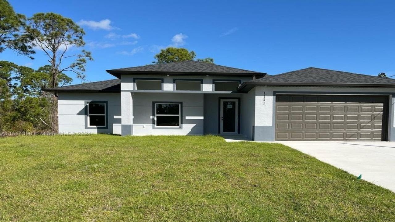 1131 Crocus St E, Lehigh Acres, FL Presented by Joaquin Gutierrez.