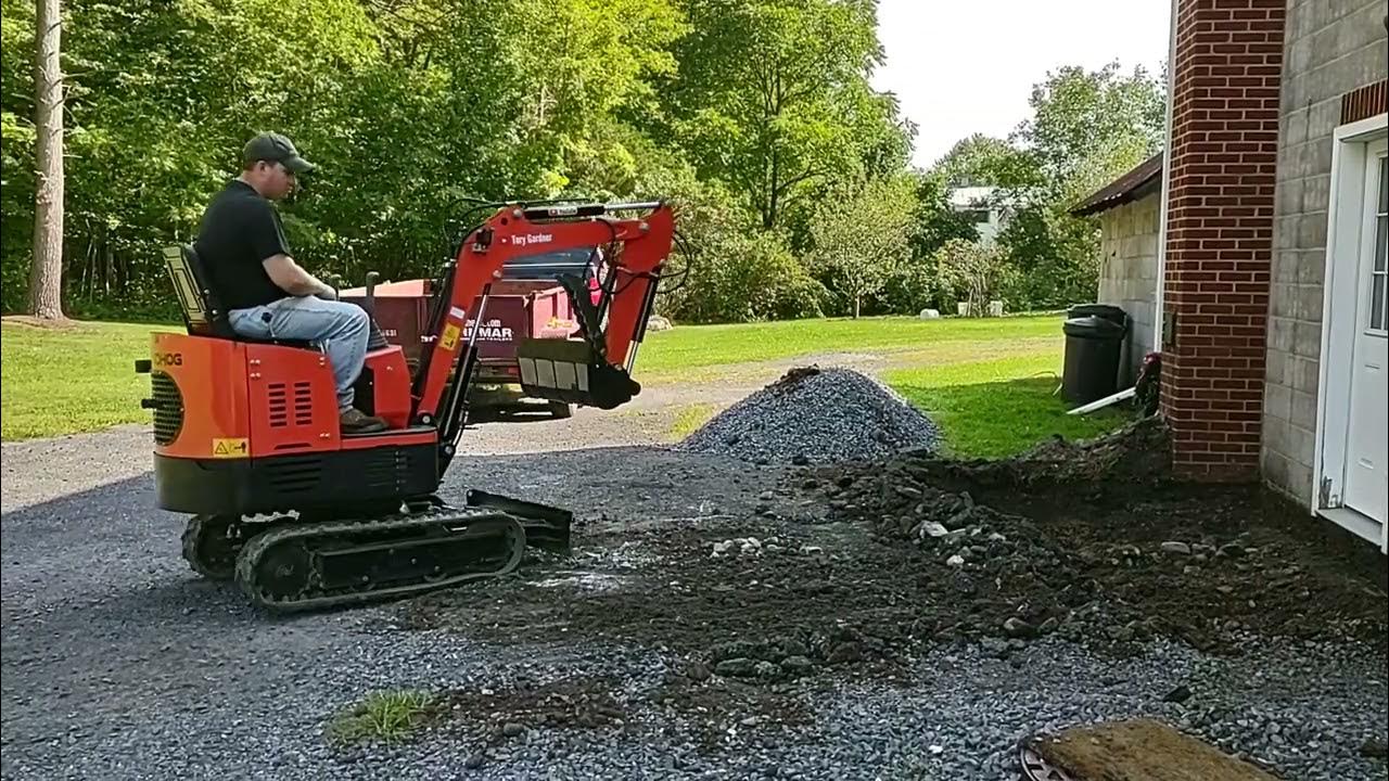 Gardner's Groundhog Mini Excavator grading with blade. - YouTube