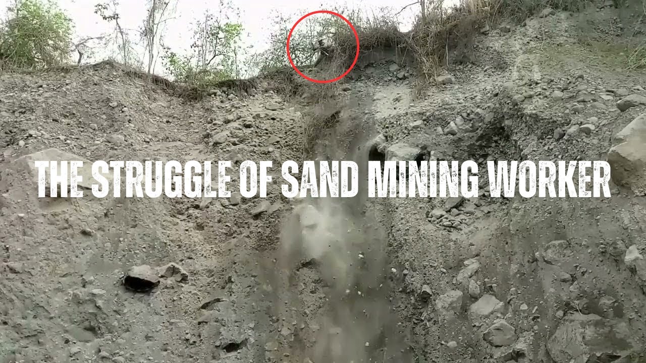 The struggle of sand mining workers on a high cliff