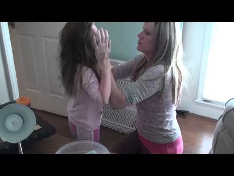 Severe Autism Meltdown. Mother Attempts to Restrain Autistic Daughter from Self-Injury