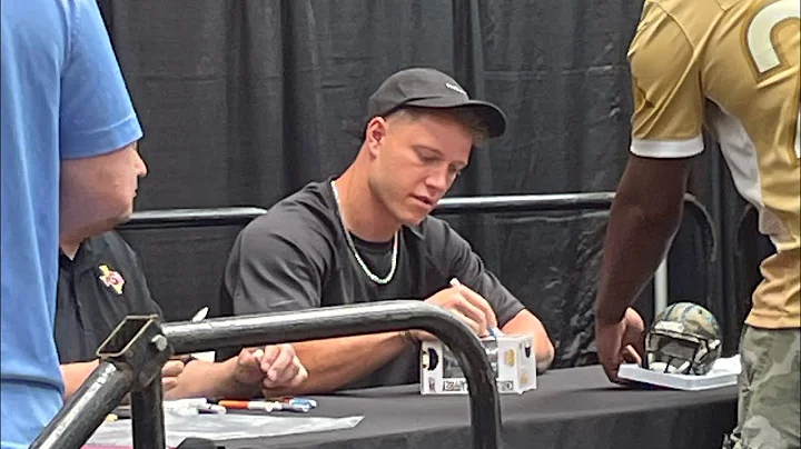 Christian McCaffrey Signing Autographs 2022