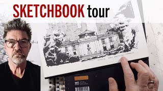 A sketchbook with watercolor paintings and ink drawings