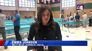 Over 200 principals and administrators make food, hygiene and  school supply backpacks for students