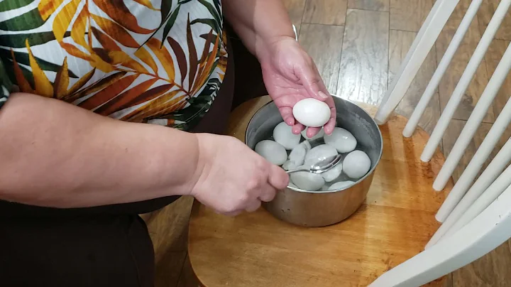 Peel a boiled egg with a spoon