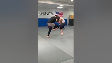 Footsweep into front headlock snap down