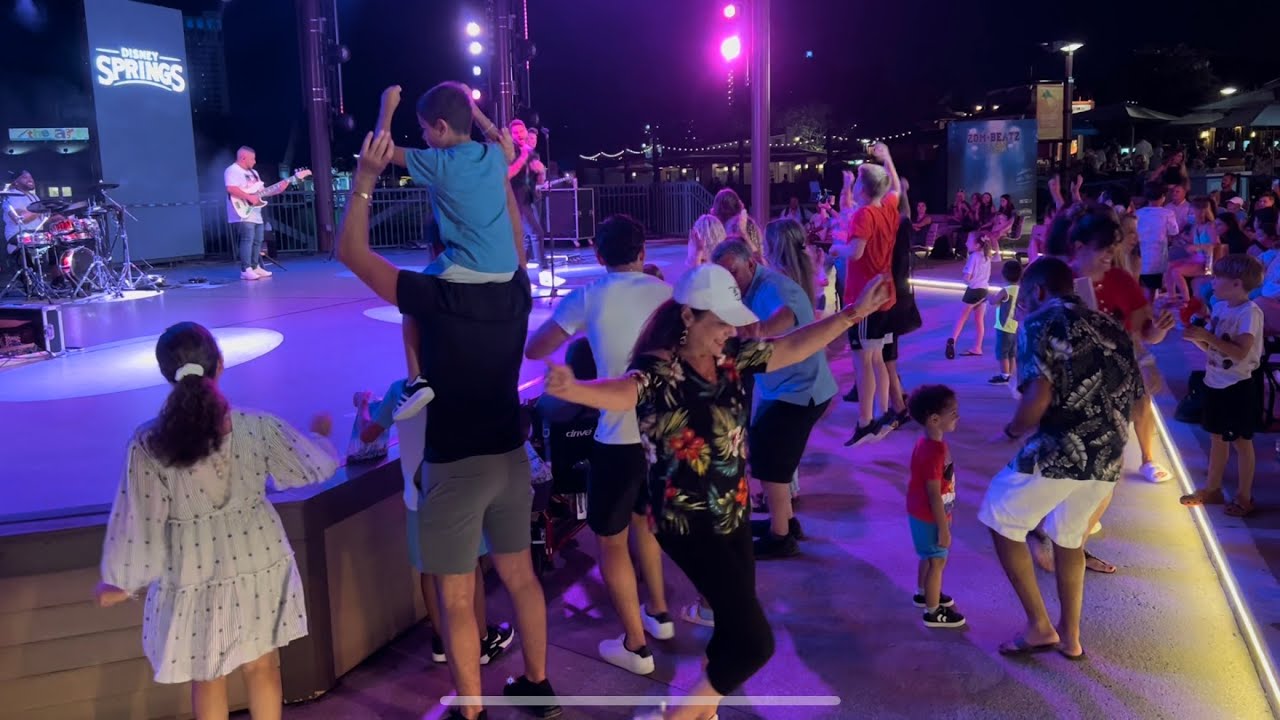 Disney Springs Dancing to Drey-C on the Waterfront Stage