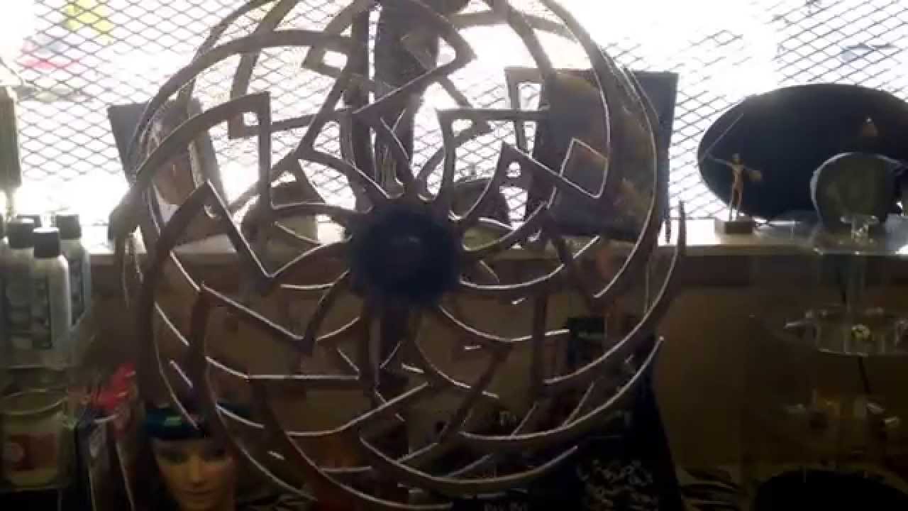 Hyzer's disc golf and smoke shop kinetic wood sculpture - Grand Rapids