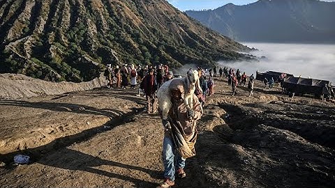 Thousands are offering ritual sacrifices on an active volcano in Indonesia