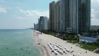 Flying Drone over Sunny Isle Ocean and Beach Line by Aqualina Resort and Trump International Resort