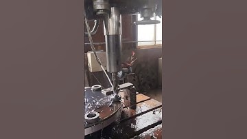 the process of drilling holes in iron using a drill to speed up the drilling process