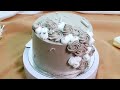 Medium grey flower cream cake with sophistication alternating pattern of gray and white flowers