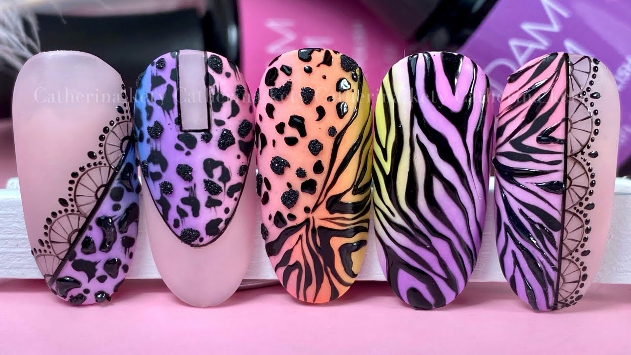 Manicure - Beautifully manicured woman fingernails. Feminine nail art with  interesting animal print nail art. Stock Photo | Adobe Stock