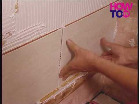 how to tile a bathroom wall doing the job