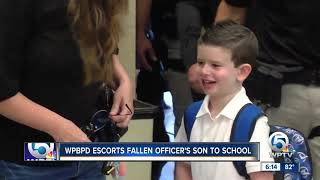 West Palm Beach police officers escort fallen officer's son to kindergarten