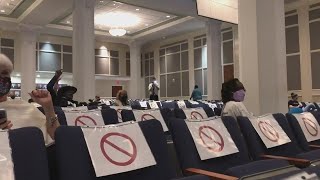 Protesters interrupt joint city council, school board meeting demanding changes to Confederate-named