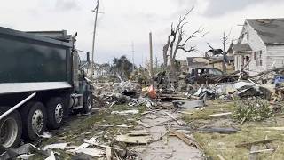 Tornado leaves damaged buildings, vehicles and downed trees as cleanup begins in Wisconsin