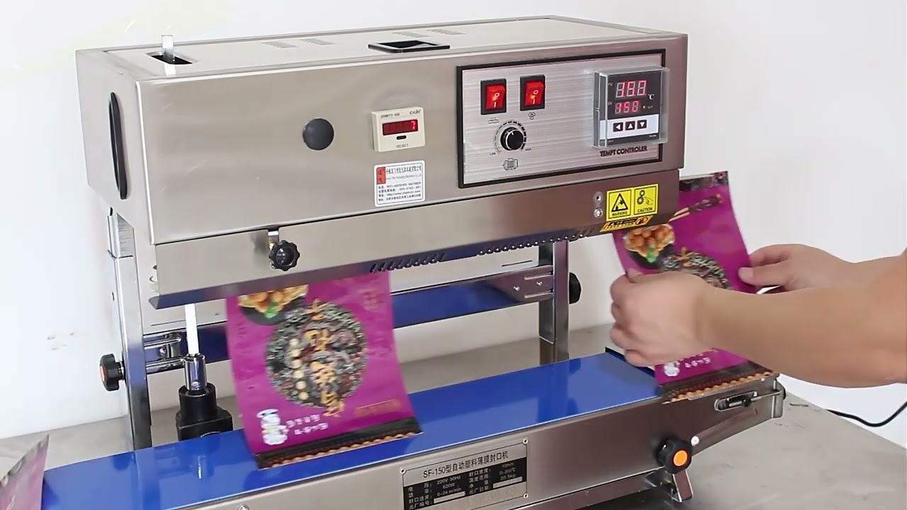 Vertical continuous band bag sealing machine