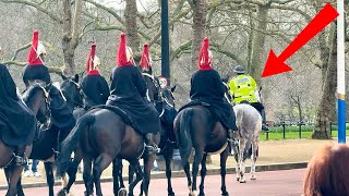 Guard shouts "ride straight" as police horse mounts sidewalk!