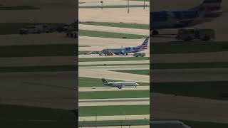 Emergency vehicles surround American Airlines plane on OHare tarmac