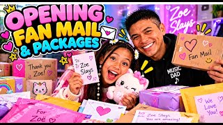 Zoe Slays opening fan mail and packages with dad and brother