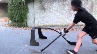 Young hockey player train with attack triangle