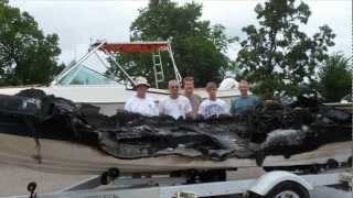Recovering a burned boat that sank in Pelican Lake