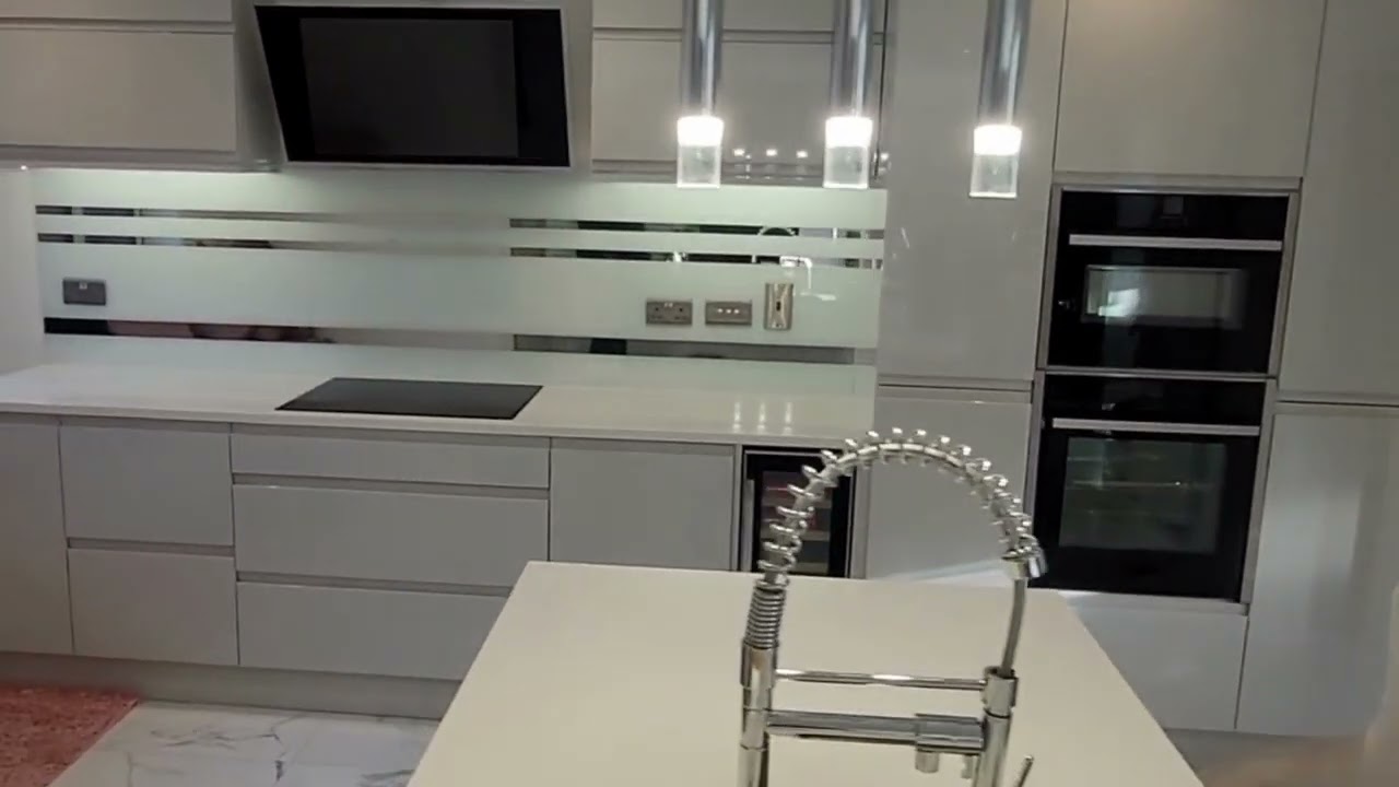 Luxury white with chrome lines kitchen glass splashback