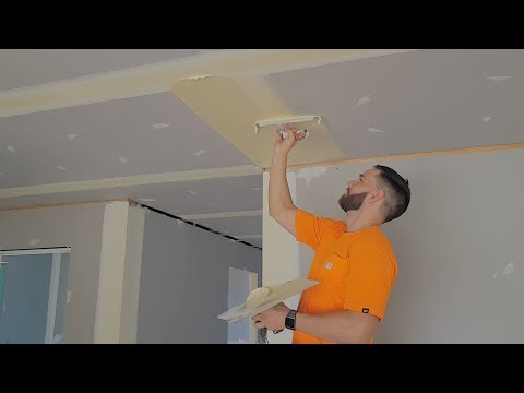 Drywall Construction Workers Finish Coating Room in Minutes