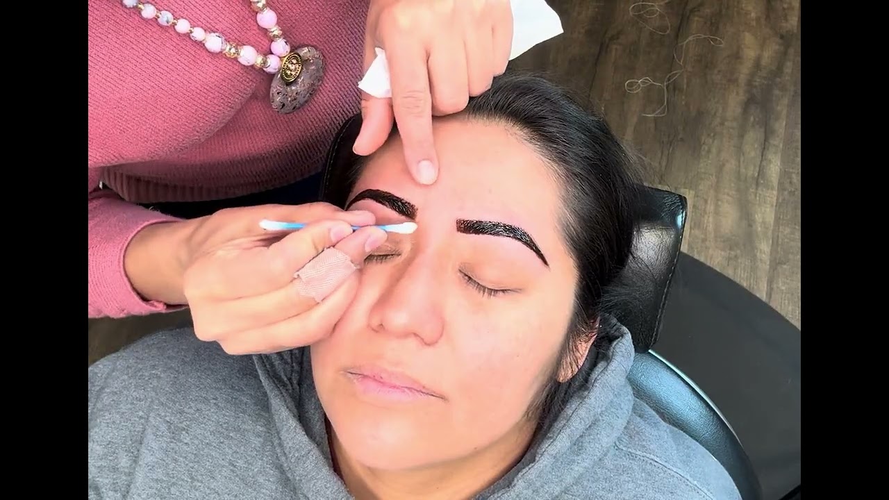 Eyebrows threading with natural henna paint on eyebrows 
