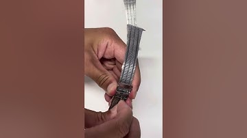 Adjusting the micro adjustable clasp on a watch strap