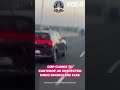 Cop clings to car roof as suspected drug smugglers flee