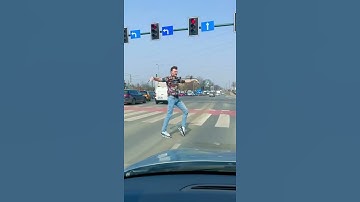 Guy Moonwalks Over Crosswalk Sign as Traffic Stops at Red Signal - 1187002-1