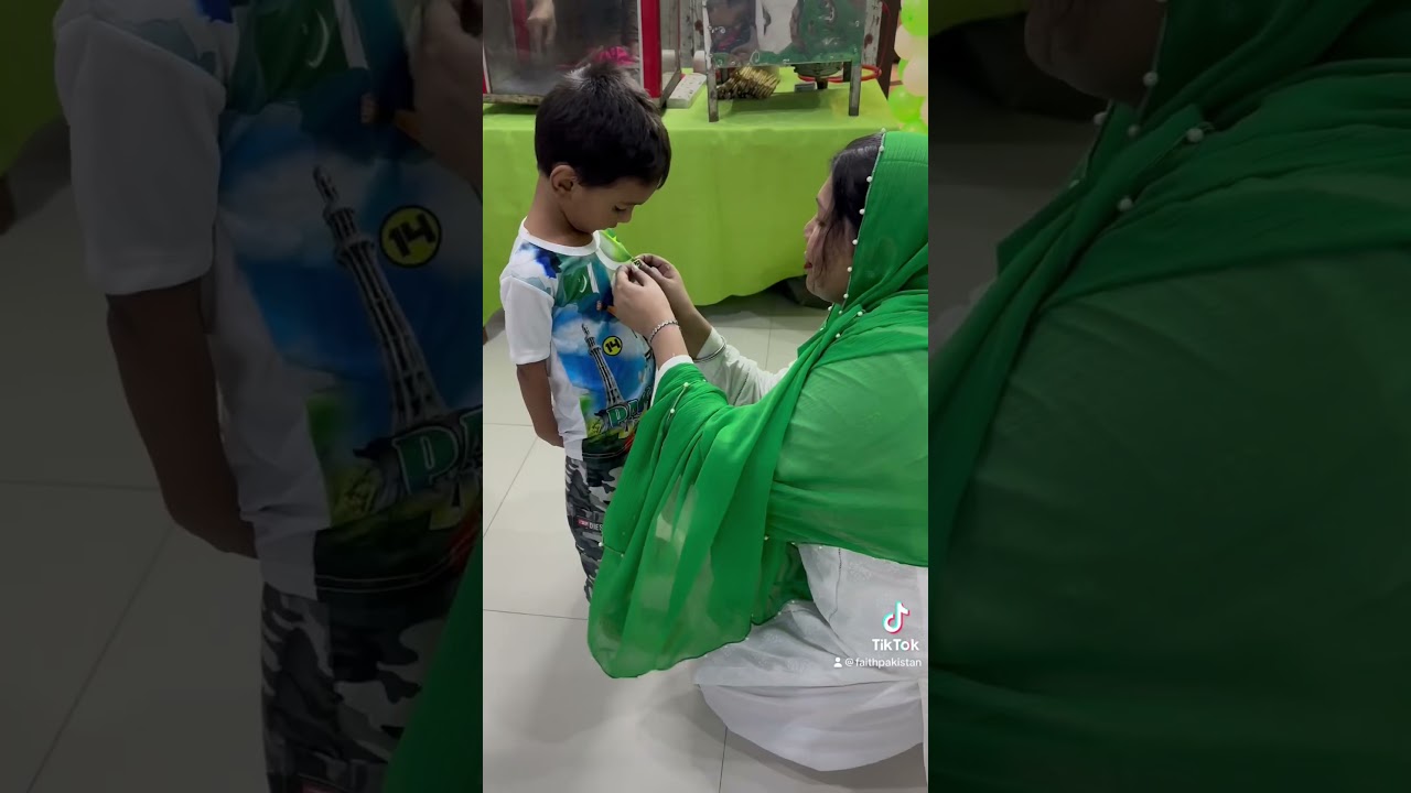 President FAiTh Ayesha Mehmood put Pakistan flag badges on the shirts of little 