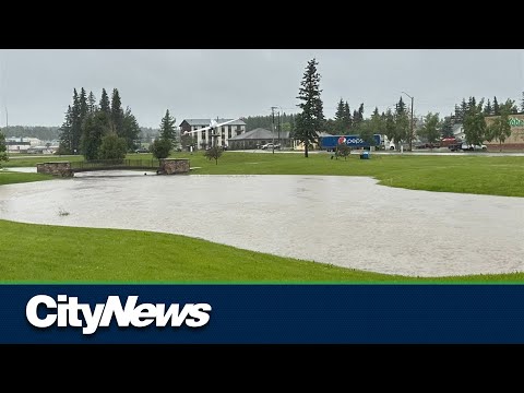 Edson residents return to floods after fleeing wildfires