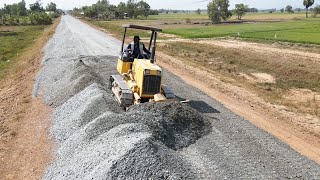 New Road Construction Installing Fast, Bulldozer Pushing Black Gravel Build Road