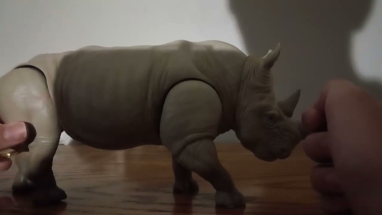 The Black Cat Reviews Jumanji Charging Rhinoceros.