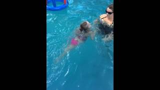 Ashlynn Taylor learning how to swim without floated.