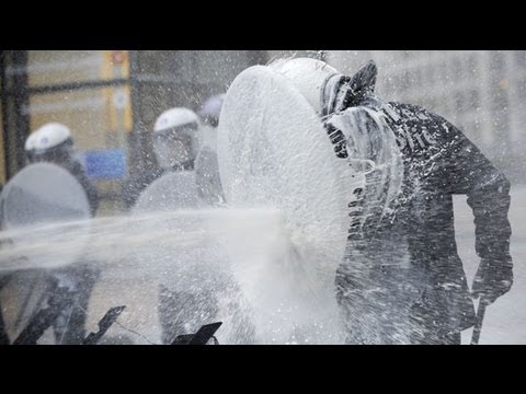 EU dairy farmers spray parliament with milk