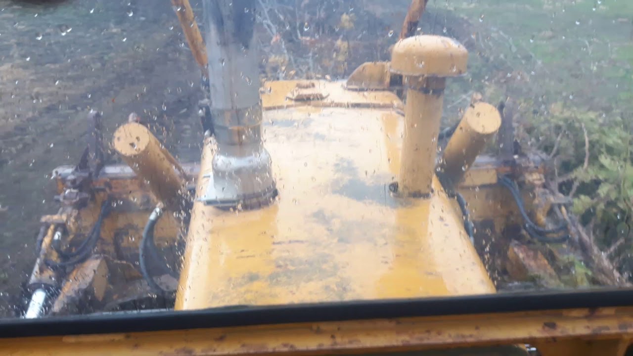 Dozing clumps of trees with the case 1150 dozer - YouTube